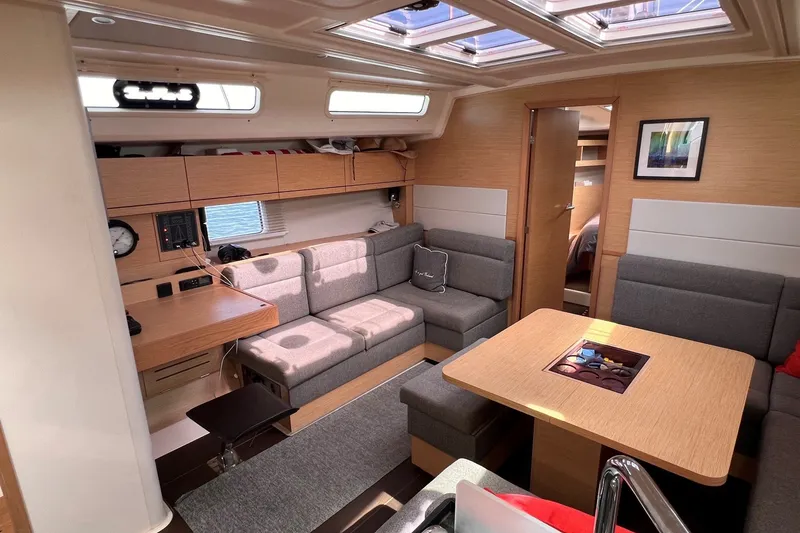 Slide: The Image of Interior of 2020 Hanse 458 yacht with modern seating and wooden finishes. - 40