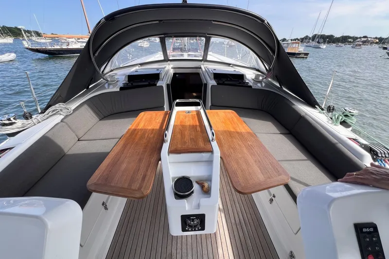 Slide: The Image of Spacious cockpit of 2020 Hanse 458 yacht with wooden tables and seating. - 21