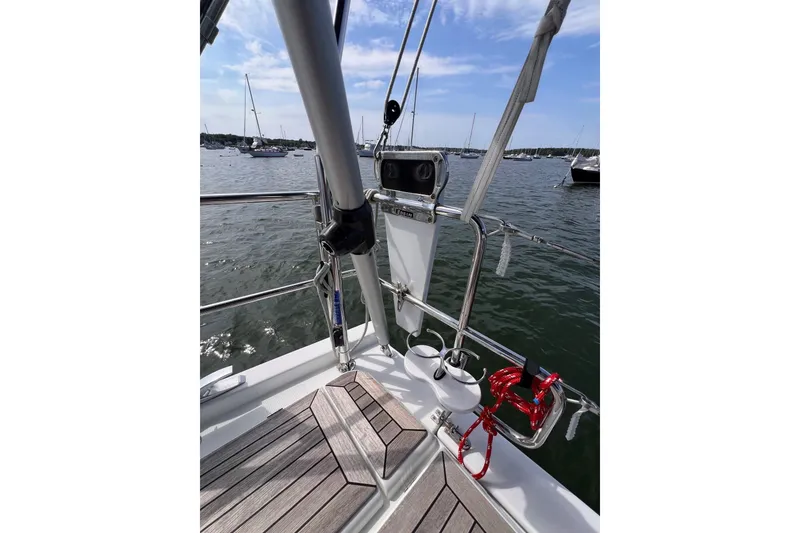 Slide: The Image of Sailing yacht Hanse 458, 2020 model, with wooden deck and marina view. - 29