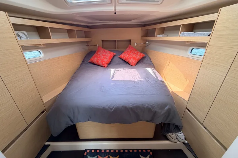 Slide: The Image of Luxurious cabin interior of 2020 Hanse 458 yacht with cozy bed and wooden finish. - 54