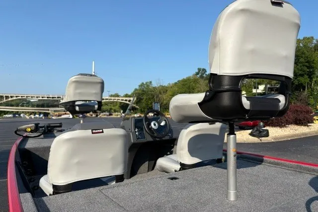 Slide: The Image of 2027 Tracker Bass Tracker Classic XL boat interior with seating and steering console. - 19