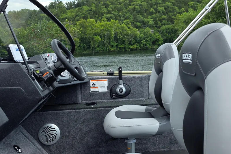 Slide: The Image of Interior of 2027 Tracker Pro Guide V-175 Combo boat with steering wheel and seats. - 17