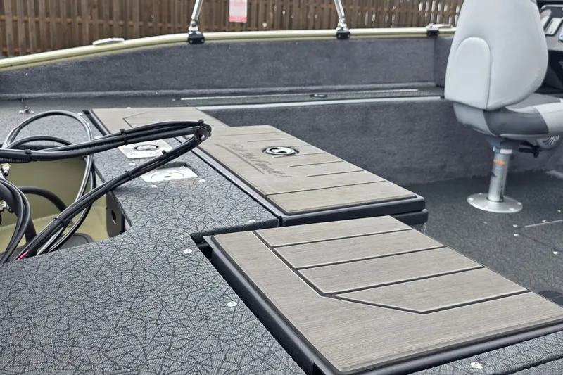 Slide: The Image of 2027 Tracker Pro Guide V-175 Combo boat interior with seating and storage compartments. - 26