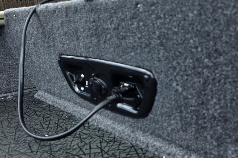 Slide: The Image of Power outlet on 2027 Tracker Pro Guide V-175 Combo boat interior. - 16