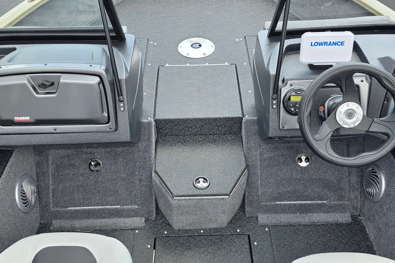 Slide: The Image of Interior view of 2027 Tracker Pro Guide V-175 Combo boat dashboard with steering wheel and controls. - 23