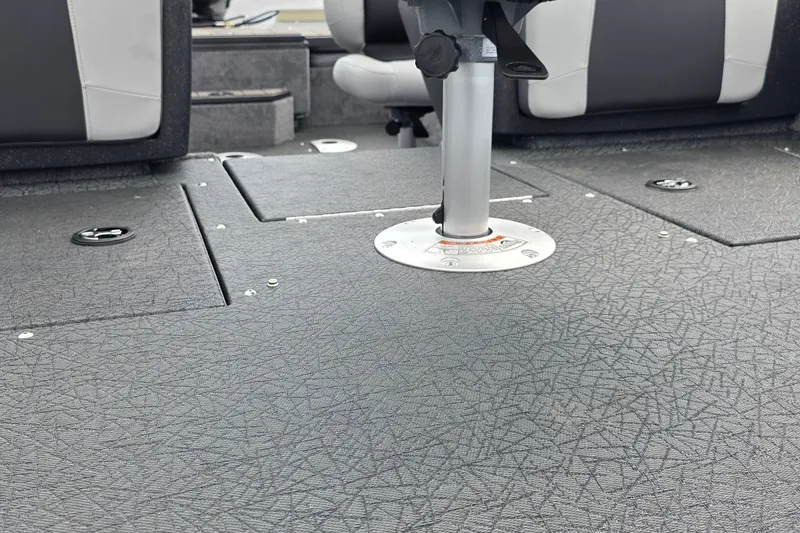 Slide: The Image of 2027 Tracker Pro Guide V-175 Combo boat interior with textured flooring and seating. - 30