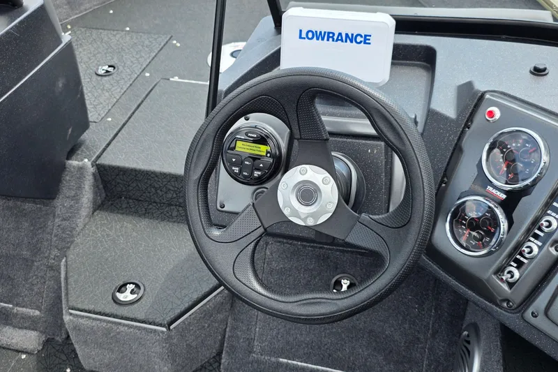 Slide: The Image of Steering wheel and dashboard of 2027 Tracker Pro Guide V-175 Combo boat. - 22