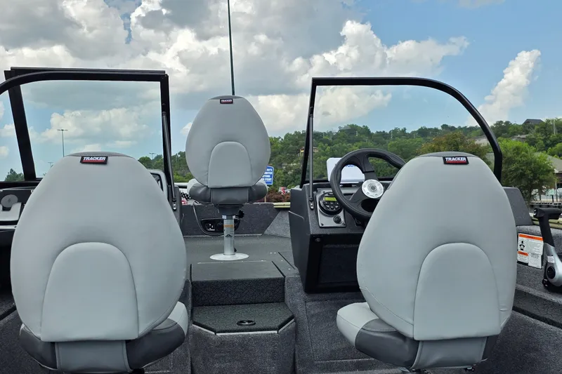 Slide: The Image of 2027 Tracker Pro Guide V-175 Combo boat interior with gray seats and steering console. - 20