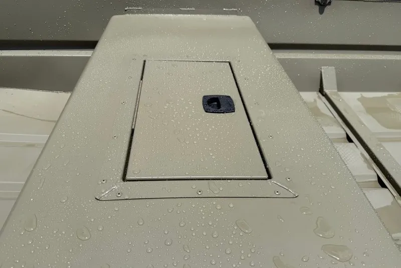 Slide: The Image of Wet deck of 2027 Tracker Grizzly 15 Jon boat with storage hatch. - 26