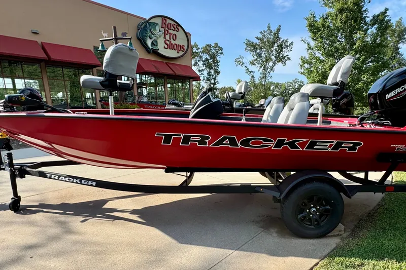 The Image of Red 2027 Tracker Pro Team 175 boat displayed outside Bass Pro Shops. - 0