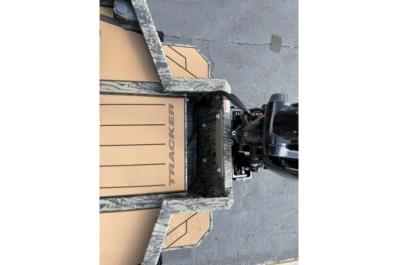 Slide: The Image of Tracker Grizzly 1553 Timber 2027 boat with camouflage design and motor, top view. - 14