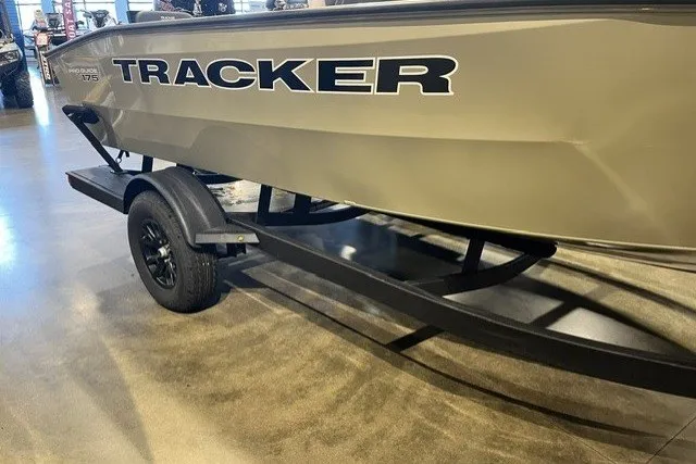 The Image of 2027 Tracker Pro Guide V-175 Combo boat on trailer in showroom. - 0