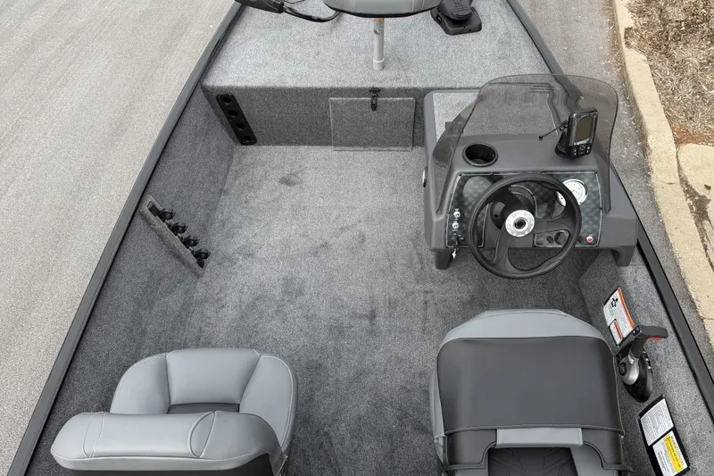 Slide: The Image of 2027 Tracker Bass Tracker Classic XL boat interior with steering console and seating. - 53