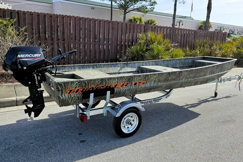 The Image of 2027 Tracker Grizzly 15 Jon boat with Mercury engine on trailer. - 0