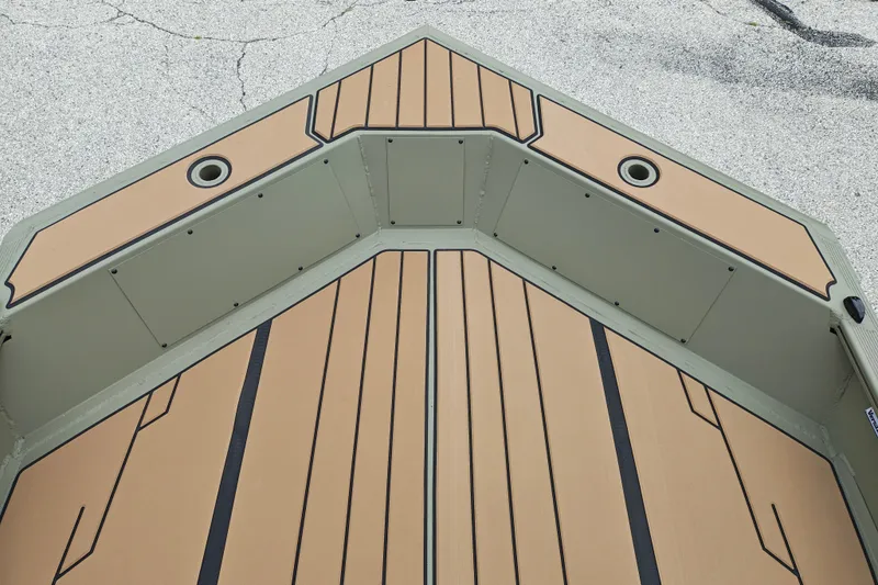 Slide: The Image of 2027 Tracker Grizzly 1553 Timber boat deck with tan and black non-slip surface. - 15