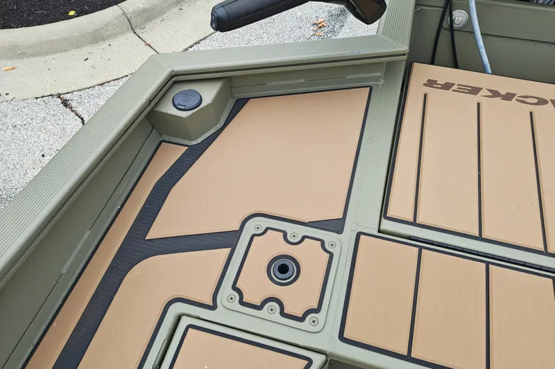 Slide: The Image of 2027 Tracker Grizzly 1553 Timber boat deck with tan and black design. - 20