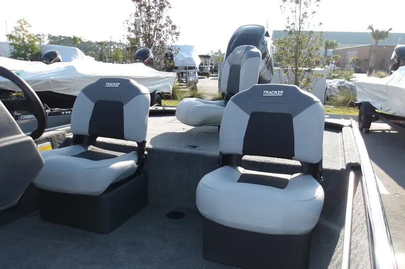 Slide: The Image of 2027 Tracker Bass Tracker Classic XL boat seats in outdoor showroom. - 17