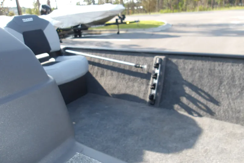 Slide: The Image of Interior view of 2027 Tracker Bass Tracker Classic XL boat, featuring seating and storage. - 14