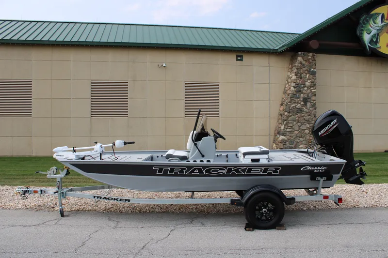 The Image of 2027 Tracker Bass Tracker Classic CC boat on trailer, parked outdoors. - 0