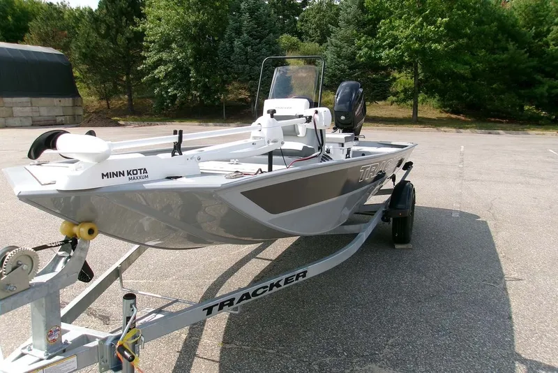 The Image of 2027 Tracker Bass Tracker Classic CC boat on trailer in parking lot. - 0