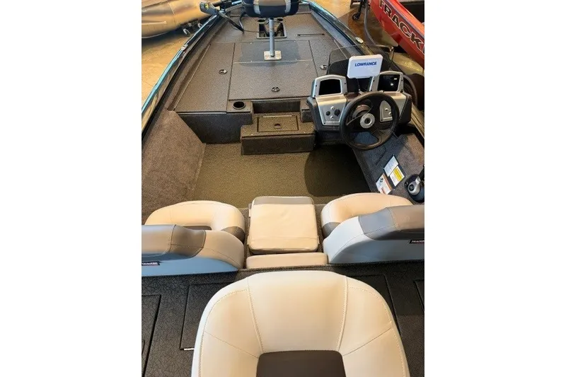 Slide: The Image of 2027 Tracker Pro Team 175 boat interior with steering wheel and seating. - 17