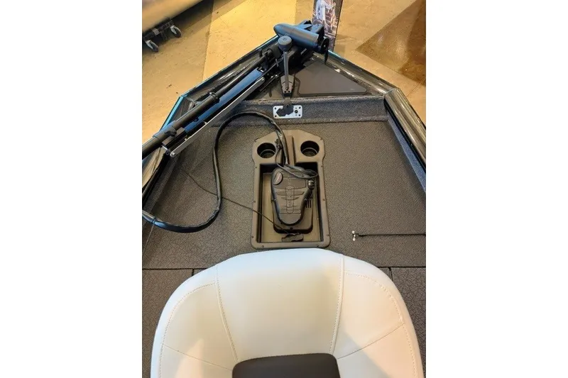 Slide: The Image of 2027 Tracker Pro Team 175 boat interior with steering controls and seating. - 13