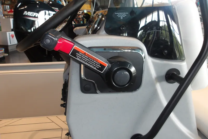 Slide: The Image of Close-up of 2027 Tracker Bass Tracker Classic CC boat steering console. - 13