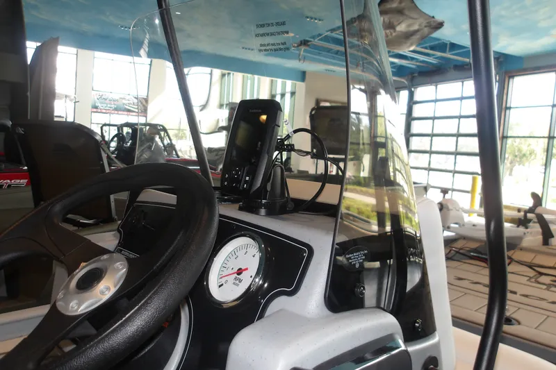 Slide: The Image of Interior view of 2027 Tracker Bass Tracker Classic CC boat dashboard with steering wheel and gauges. - 15