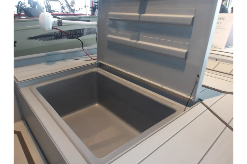 Slide: The Image of Open storage compartment on 2027 Tracker Bass Tracker Classic CC boat. - 17