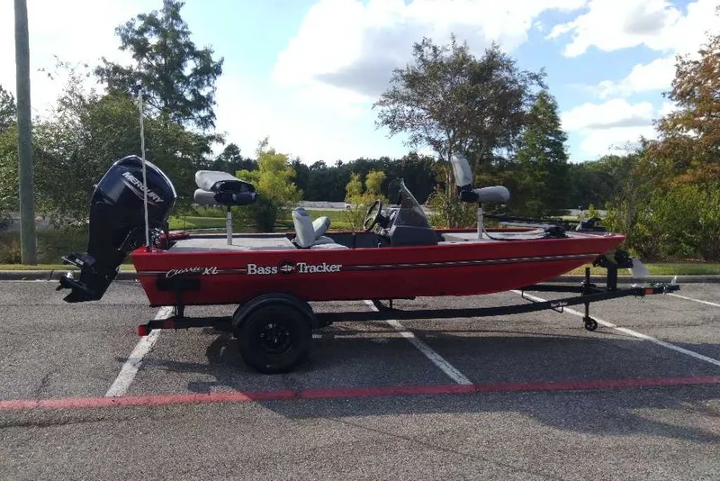 The Image of 2027 Tracker Bass Tracker Classic XL boat on trailer in parking lot. - 0