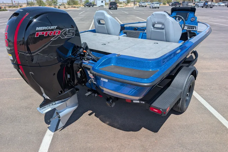 Slide: The Image of 2027 Nitro Z18 XL Pro boat with Mercury Pro XS engine in a parking lot. - 1