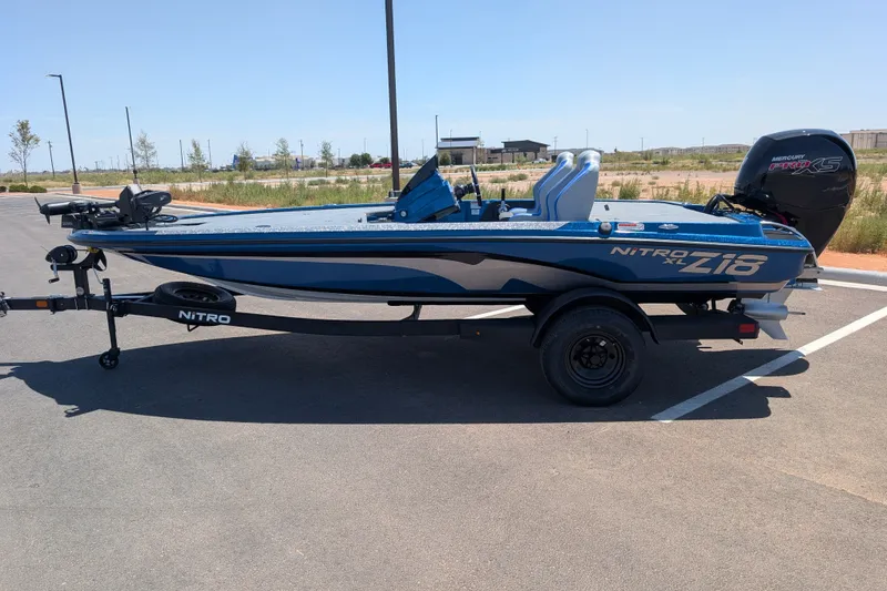Slide: The Image of 2027 Nitro Z18 XL Pro boat on trailer in parking lot. - 5