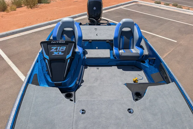 Slide: The Image of 2027 Nitro Z18 XL Pro boat interior with blue seats and spacious deck. - 10
