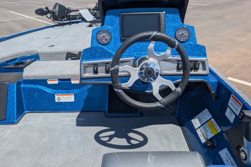 Slide: The Image of 2027 Nitro Z18 XL Pro boat cockpit with steering wheel and dashboard controls. - 7