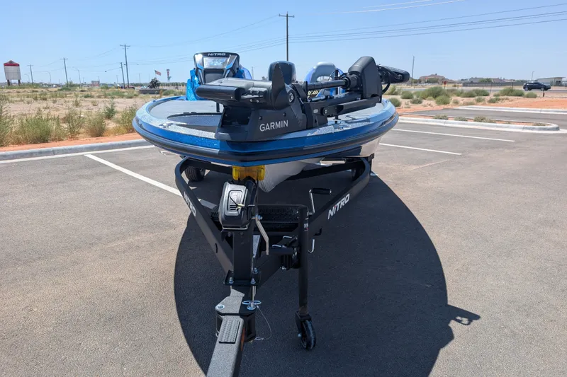 Slide: The Image of 2027 Nitro Z18 XL Pro boat with Garmin equipment in a parking lot. - 2