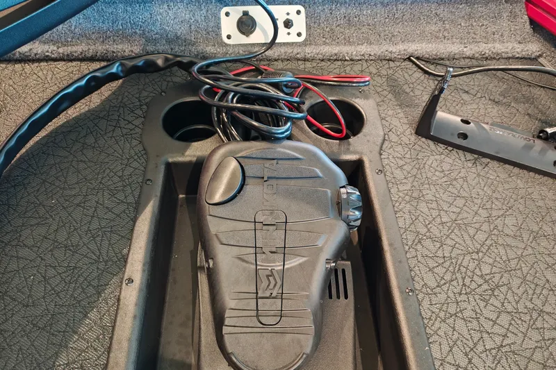 Slide: The Image of Foot pedal control on 2027 Tracker Pro Team 175 boat, with wiring and textured surface. - 19