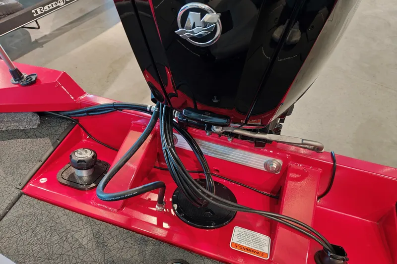 Slide: The Image of 2027 Tracker Pro Team 175 boat engine compartment with cables and controls. - 25