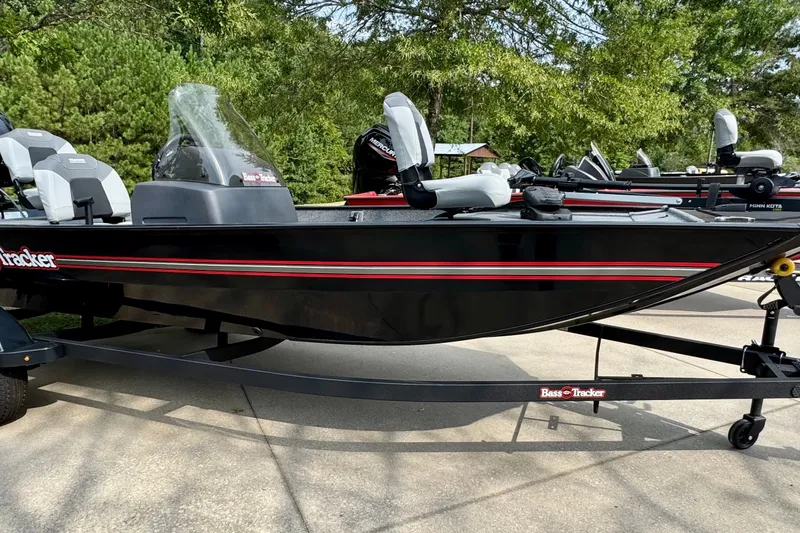The Image of 2027 Tracker Bass Tracker Classic XL boat with sleek black design and red accents. - 0