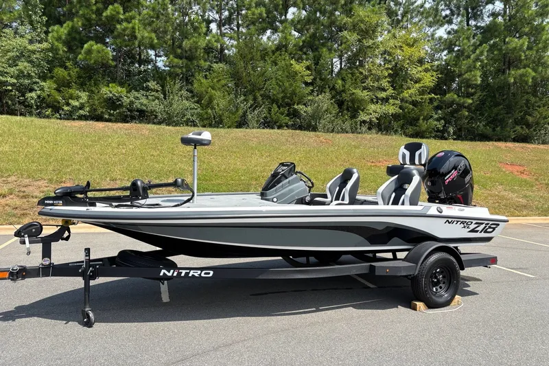 Slide: The Image of 2027 Nitro Z18 XL fishing boat on trailer, parked outdoors. - 1