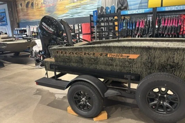 The Image of 2027 Tracker Grizzly 1553 Timber boat on trailer in showroom. - 0