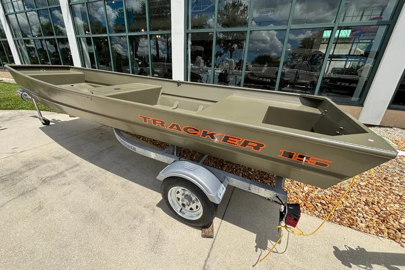 The Image of 2027 Tracker Grizzly 15 Jon boat on trailer, displayed outdoors. - 0