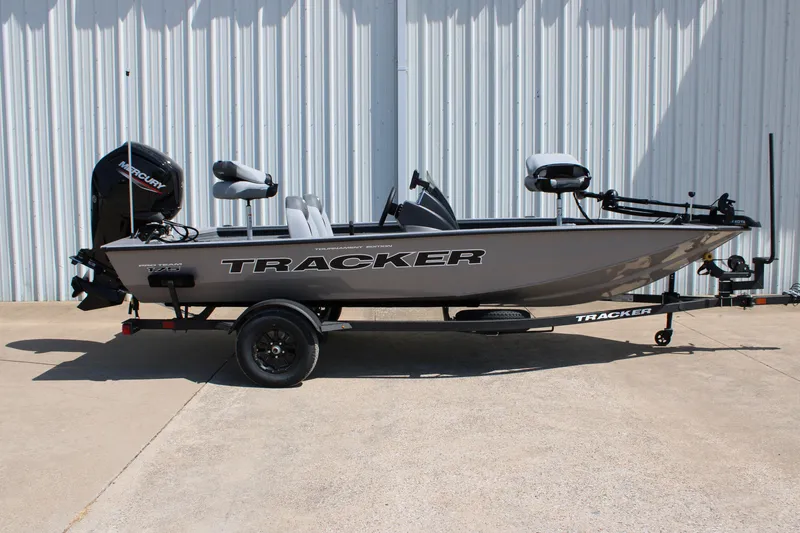 The Image of 2027 Tracker Pro Team 175 boat on trailer, parked outdoors. - 0