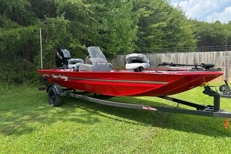The Image of 2027 Tracker Bass Tracker Classic XL boat on trailer, parked on grass. - 0