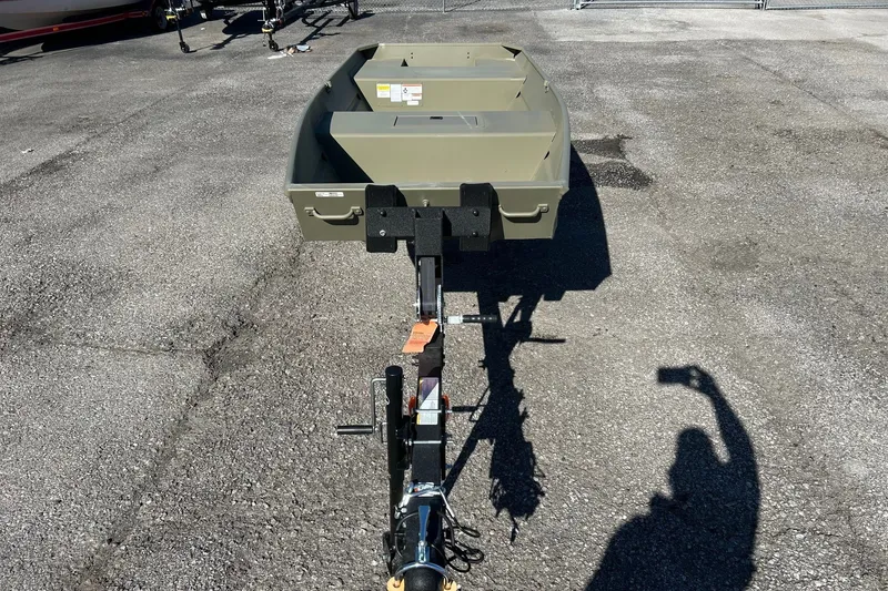 Slide: The Image of 2027 Tracker Grizzly 15 Jon boat on trailer in parking lot. - 21