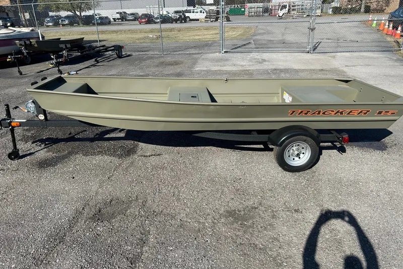 The Image of 2027 Tracker Grizzly 15 Jon boat on trailer in outdoor lot. - 0
