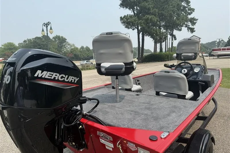 Slide: The Image of 2027 Tracker Bass Tracker Classic XL boat with Mercury engine, parked outdoors. - 14