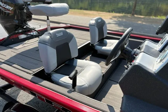 Slide: The Image of 2027 Tracker Pro 170 boat interior with gray seats and steering wheel. - 18