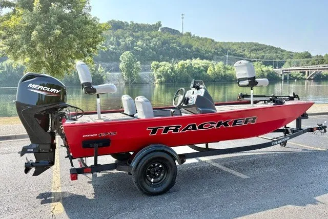 Slide: The Image of 2027 Tracker Pro 170 boat with Mercury engine, parked by a scenic river. - 13