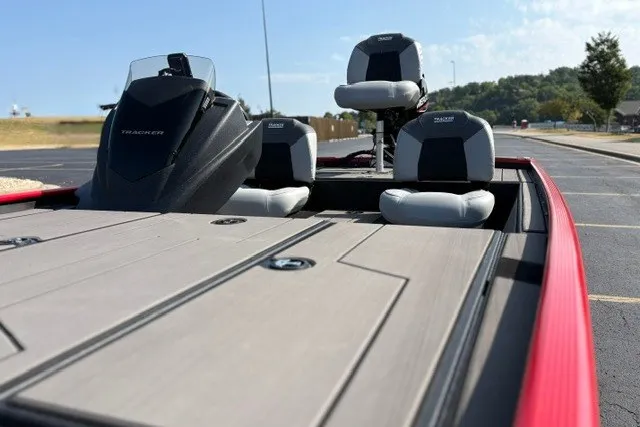 Slide: The Image of 2027 Tracker Pro 170 boat with sleek seating and modern design on a sunny day. - 22
