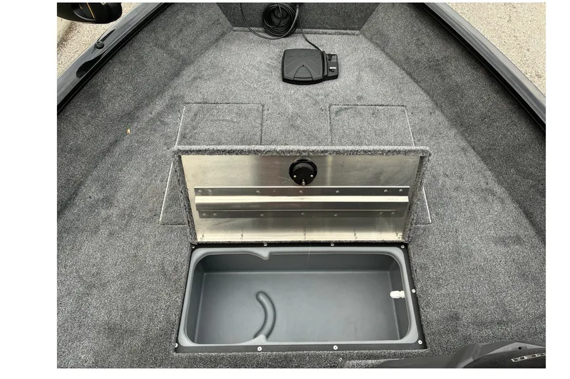 Slide: The Image of Interior of 2027 Tracker Super Guide V-16 SC boat with storage compartment open. - 34